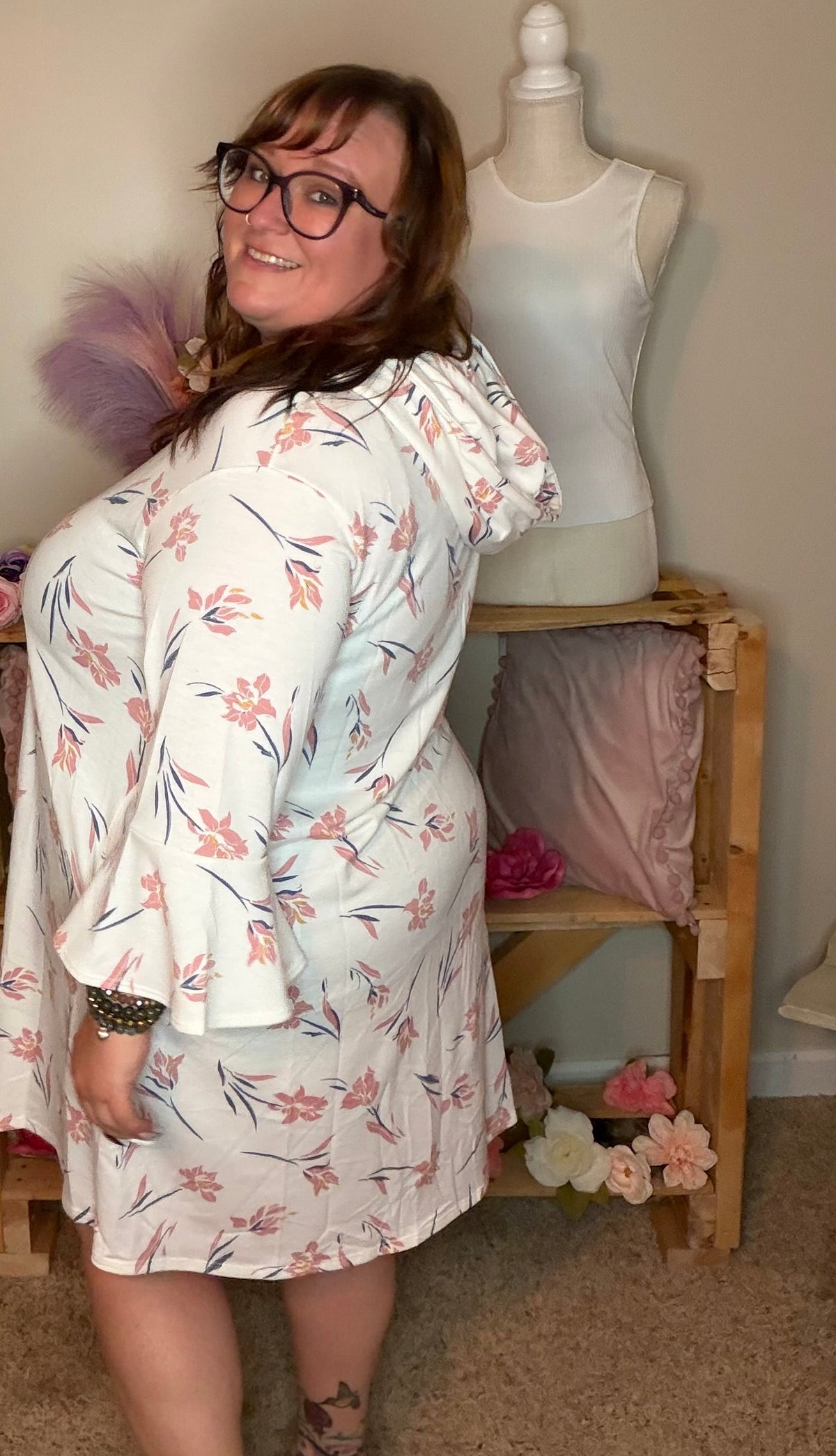 Front view of ivory pink floral dress with flared sleeves