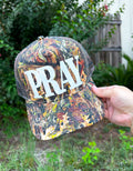 PRAY (white font) Real Camo Canvas Trucker Hat - TheRusticAttic